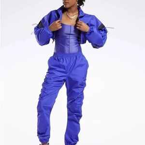 REEBOK X CARDI B WOVEN CROP JACKET
Ultima Purple